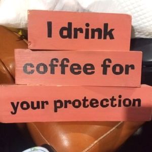 Cute painted block sign. Free standing. "I drink coffee for your protection"